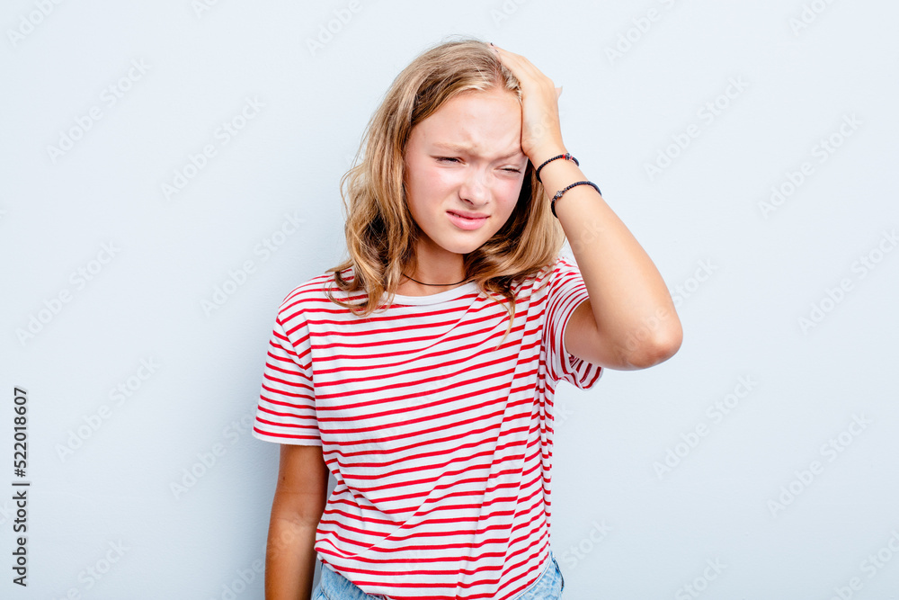Caucasian teen girl isolated on blue background forgetting something, slapping forehead with palm and closing eyes. Caucasian teen girl isolated on blue background forgetting something, slapping forehead with palm and closing eyes.