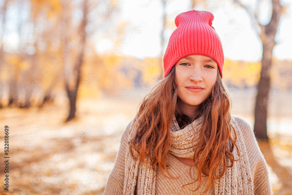 Carefree young woman in autumn park Carefree young woman in autumn park