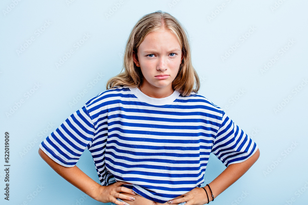 Caucasian teen girl isolated on blue background sad, serious face, feeling miserable and displeased. Caucasian teen girl isolated on blue background sad, serious face, feeling miserable and displeased.
