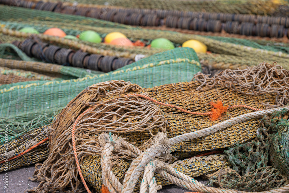 Colored nets and ropes on a quay.
