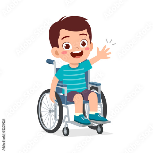 little kid sit on wheelchair and feel happy