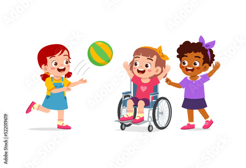 little kid on wheelchair play ball with friend