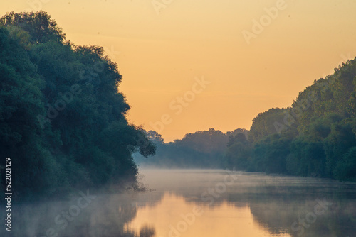 Early morning river.  fog trees. sunlight mist  water. Olanesti Moldova Dniester river reflection, beautiful   summer landscape sunrise quiet fishing spot forest © Victoria Moloman