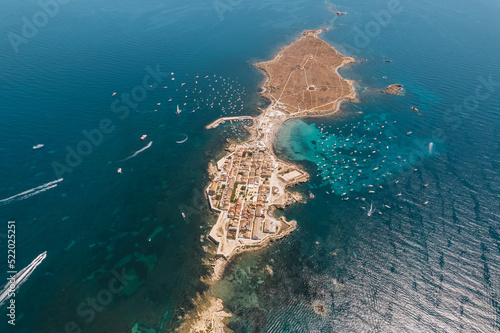 Aerial view of Tabarca island with boats at anchor. Mediterranean Sea. Popular travel destinations at summer. Spain. photo