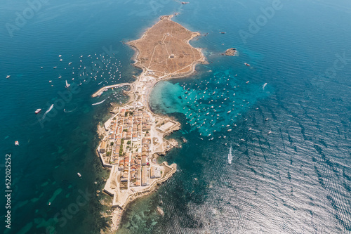 Aerial view of Tabarca island with boats at anchor. Mediterranean Sea. Popular travel destinations at summer. Spain. photo