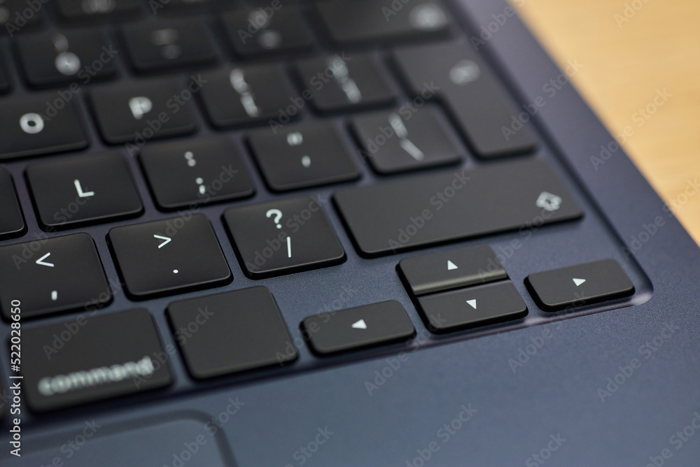 Modern, slim, backlit laptop membrane keyboard. Black keyboard large board. Selective focus. close-up of laptop keys. Modern, slim, backlit laptop membrane keyboard. Black keyboard large board. Selective focus. close-up of laptop keys.