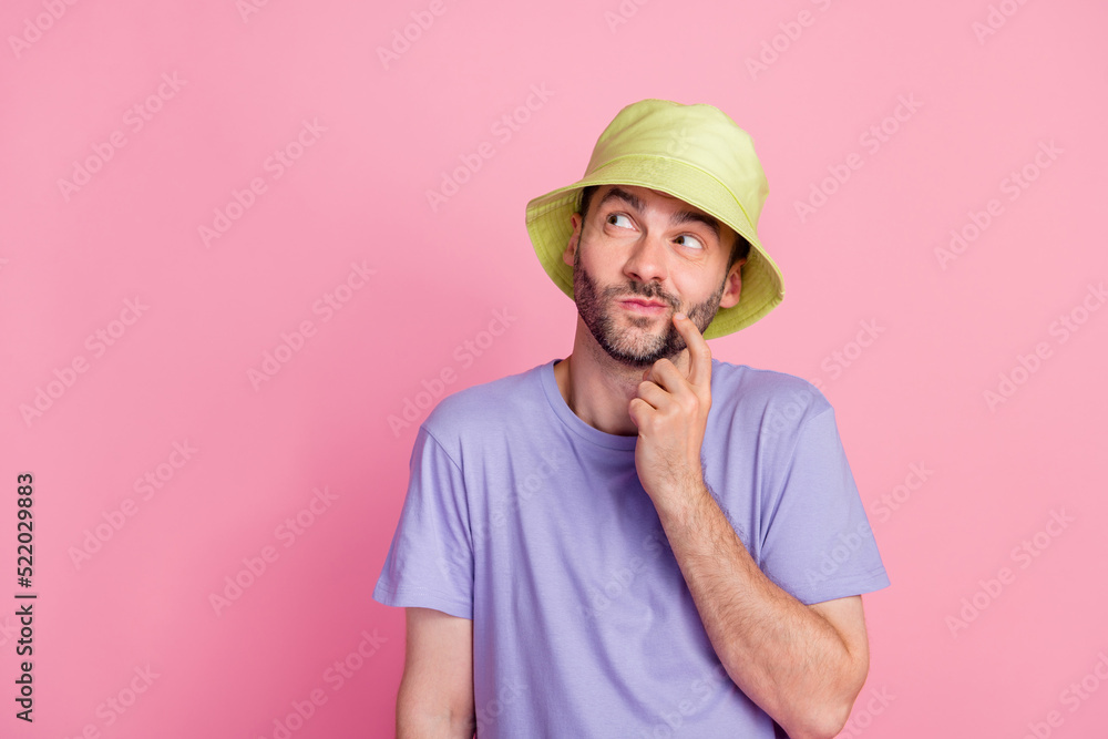 Photo of young guy good mood interested look empty space arm finger touch face cunning plan isolated on pink color background Photo of young guy good mood interested look empty space arm finger touch face cunning plan isolated on pink color background