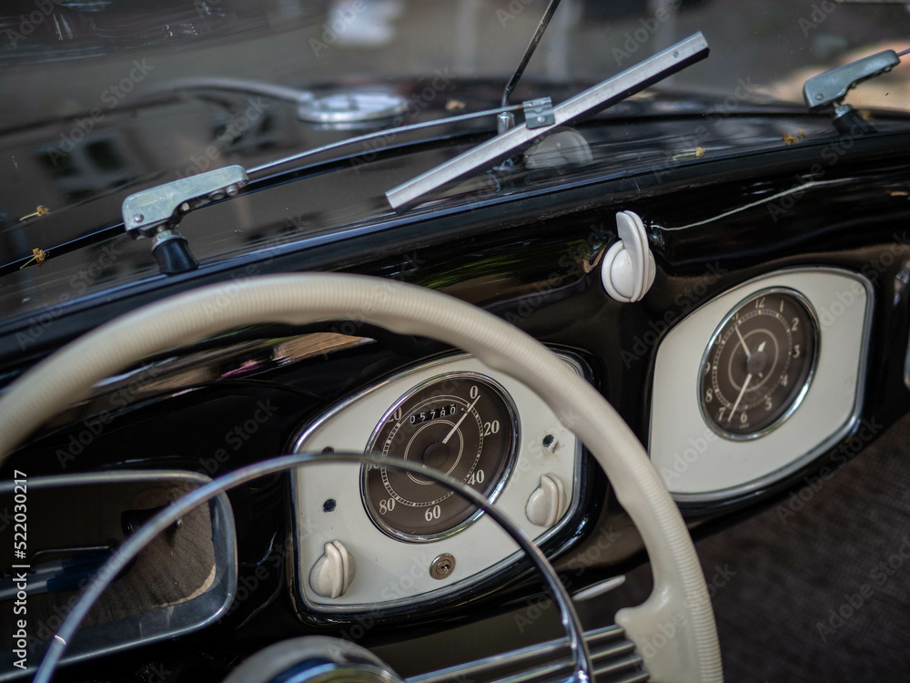 Dashboard and steering wheel of old-timer car