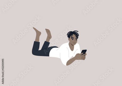 A young male African character lying on their stomach and checking their phone