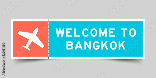 Orange and blue color ticket with plane icon and word welcome to bangkok on gray background