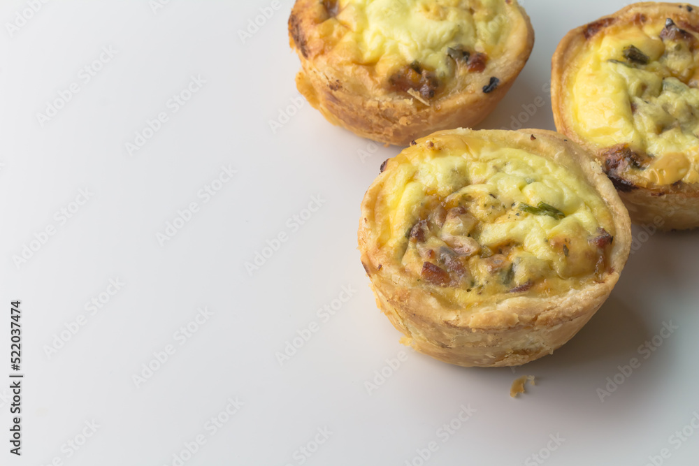 Fototapeta premium Mini quiche with bacon and herbs with copy space