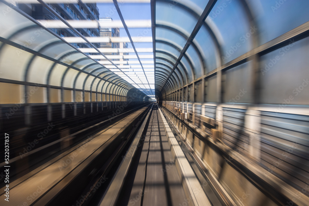 Fototapeta premium Motion blur of train moving inside tunnel