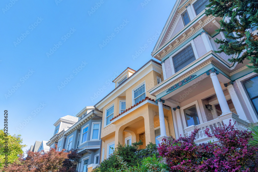 Row of houses in a low angle view with victorian and mediterranean design at San Francisco, CA Row of houses in a low angle view with victorian and mediterranean design at San Francisco, CA