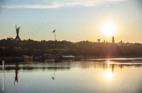 View of Kyiv from left bank of Dnipro river at sunset