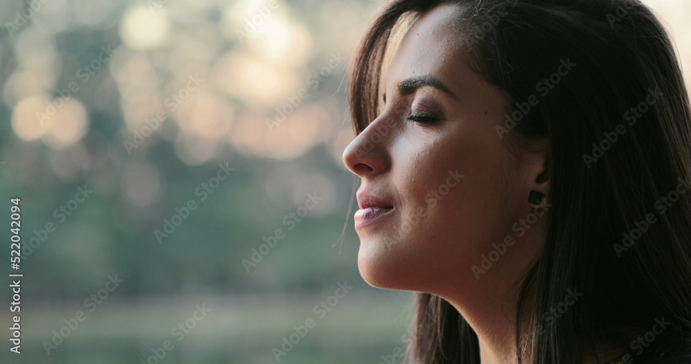 Hispanic woman with eyes closed having faith Hispanic woman with eyes closed having faith