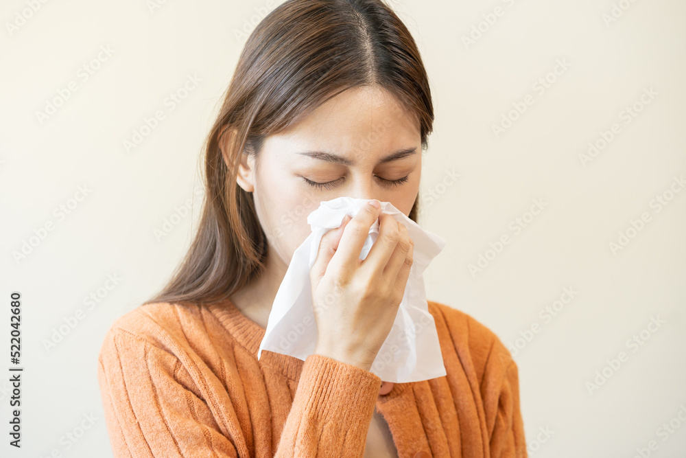 Sick, Coronavirus covid asian young woman, girl have a fever, flu, hand in use tissues paper sneezing nose, runny and cough, standing on isolated background. Health care to disease influenza seasonal Sick, Coronavirus covid asian young woman, girl have a fever, flu, hand in use tissues paper sneezing nose, runny and cough, standing on isolated background. Health care to disease influenza seasonal