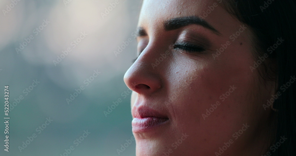 Hispanic latina beautiful young woman closing eyes and taking a deep breath and then opening eyes again Hispanic latina beautiful young woman closing eyes and taking a deep breath and then opening eyes again
