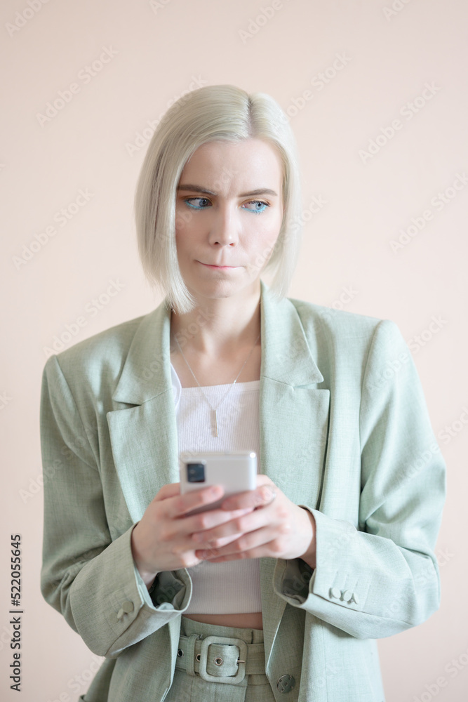 Young woman read bad news on smartphone. Young woman read bad news on smartphone.