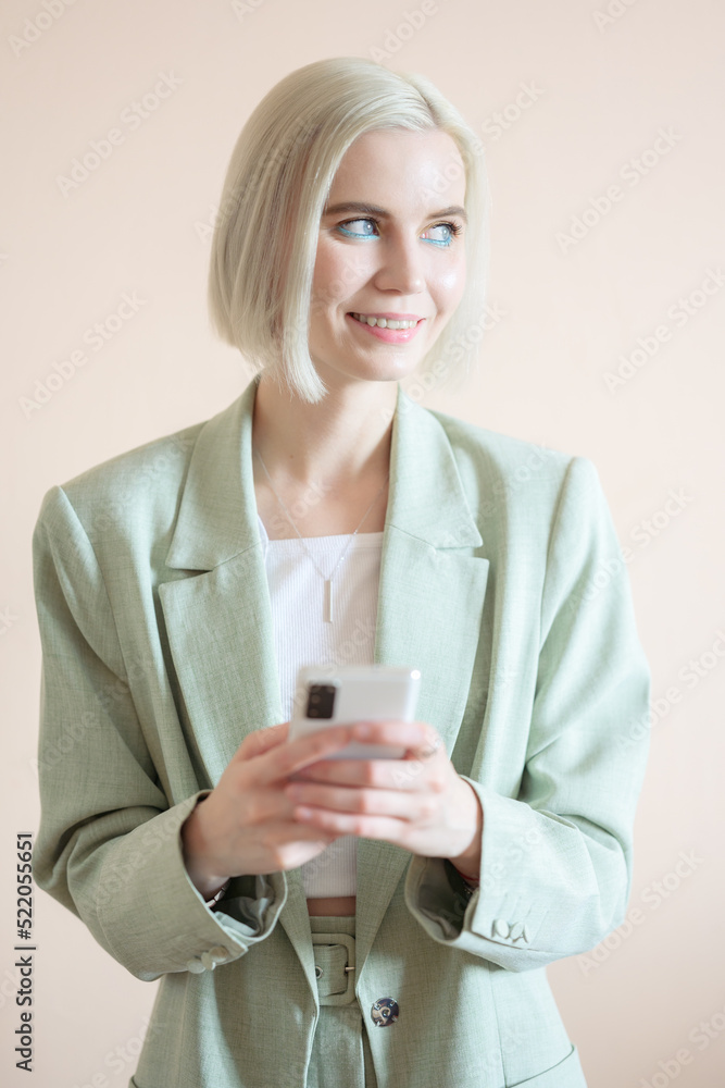 Young woman read news on smartphone and smile. Young woman read news on smartphone and smile.