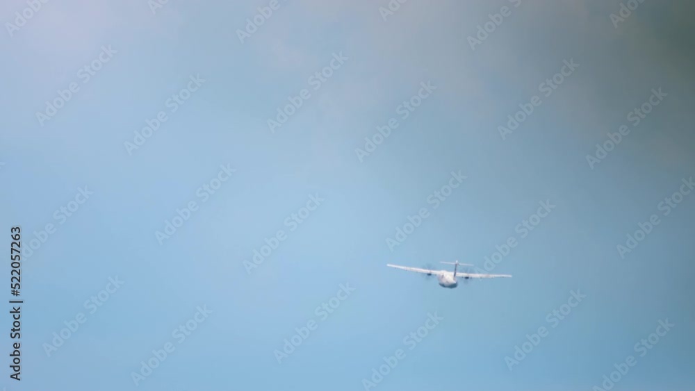 Long shot rear view of a turboprop aircraft taking off and climbing. Tourism and travel concept Long shot rear view of a turboprop aircraft taking off and climbing. Tourism and travel concept