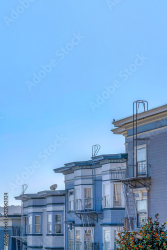 Sloped residential buildings with emergency stairs against the clear sky at San Francisco, CA