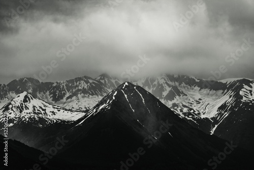 View of Mount Carlisle covered with snow under thick clouds on Carlisle Island photo