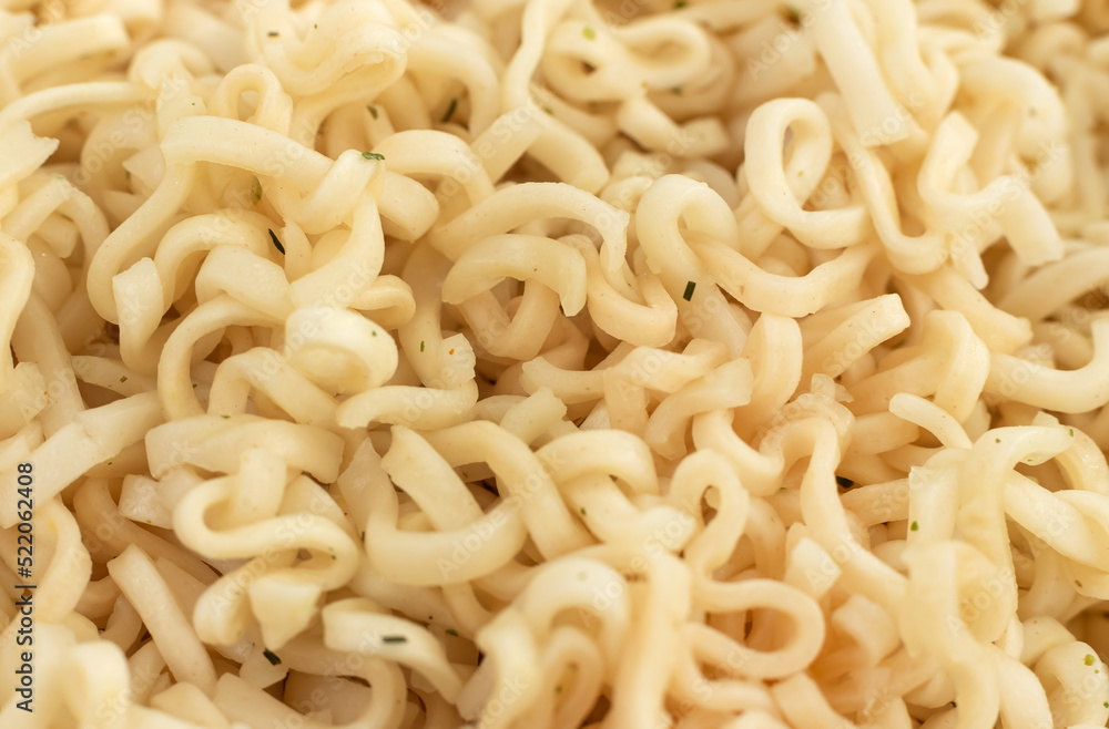 Background of instant noodles close-up with seasonings. Pasta Background of instant noodles close-up with seasonings. Pasta