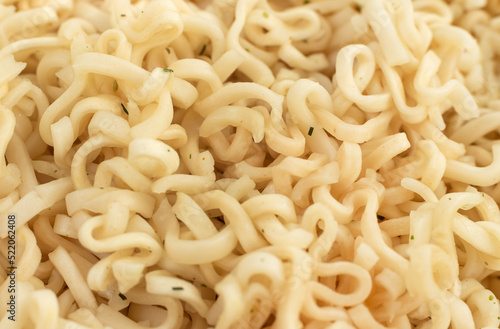 Background of instant noodles close-up with seasonings. Pasta