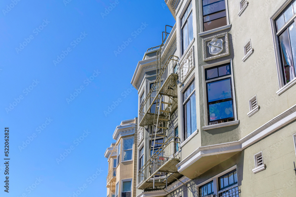 Apartment building with decorative bay window wall ornaments and vents