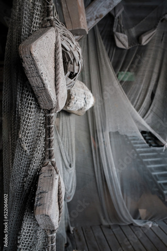 Old fishing nets hung along the walls background