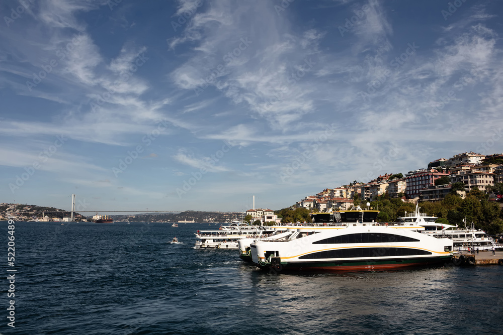 View of moored boats at Uskudar port by Bosphorus in Istanbul. It is sunny summer day.