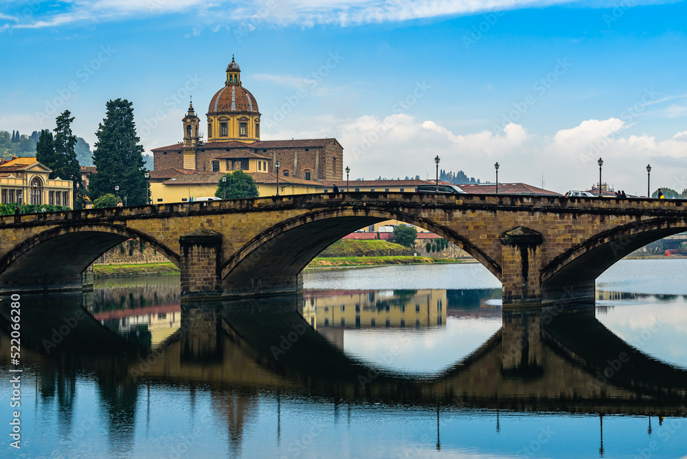 San Frediano in Cestello church with bridge Ponte alla Carraia over Arno river in Florence.