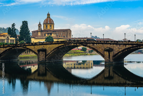 San Frediano in Cestello church with bridge Ponte alla Carraia over Arno river in Florence. photo