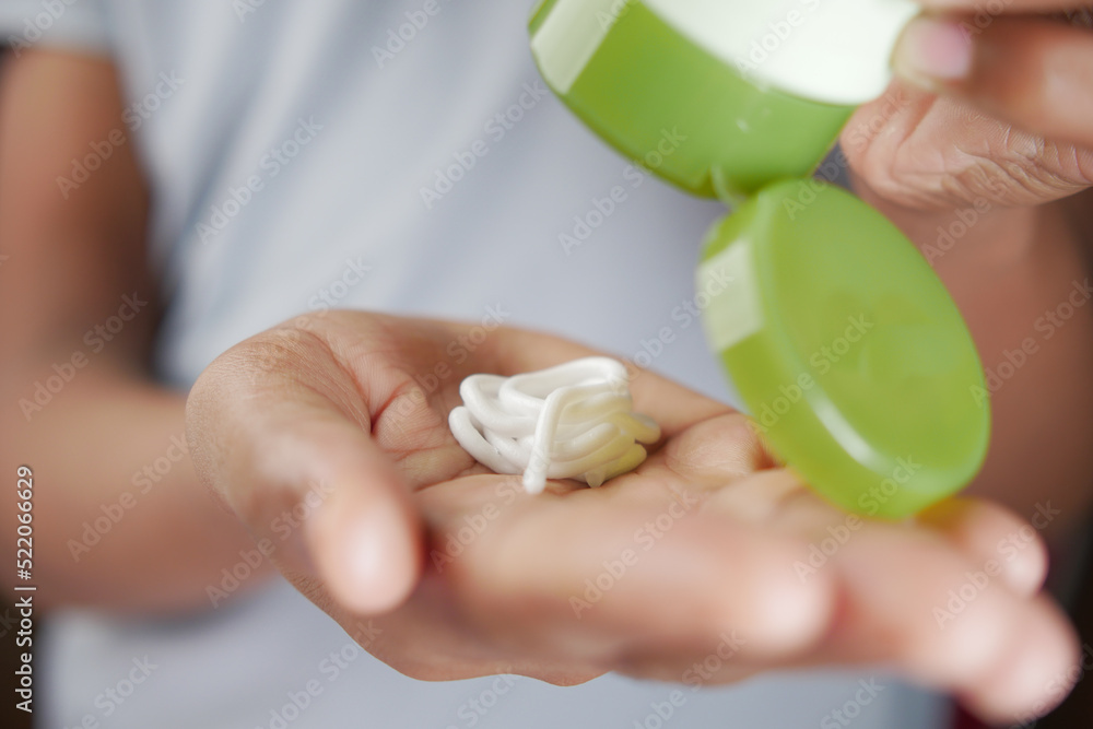 pouring aloe vera face cream on hand pouring aloe vera face cream on hand