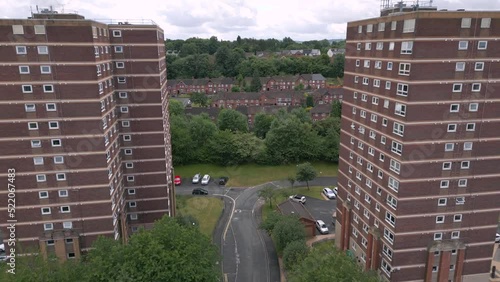 Generic aerial view of British council housing tower blocks and town streets