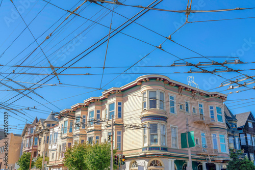 Photography Cable car trolley electric wires at the front of residential buildings at San Fr