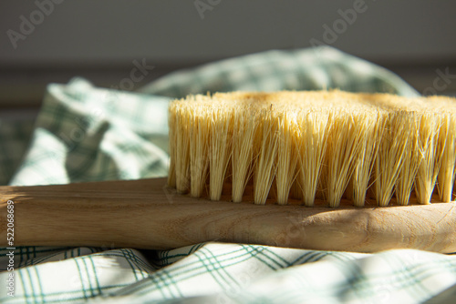 Valokuva Dry natural bristle brush with wooden handle for anti cellulite massage