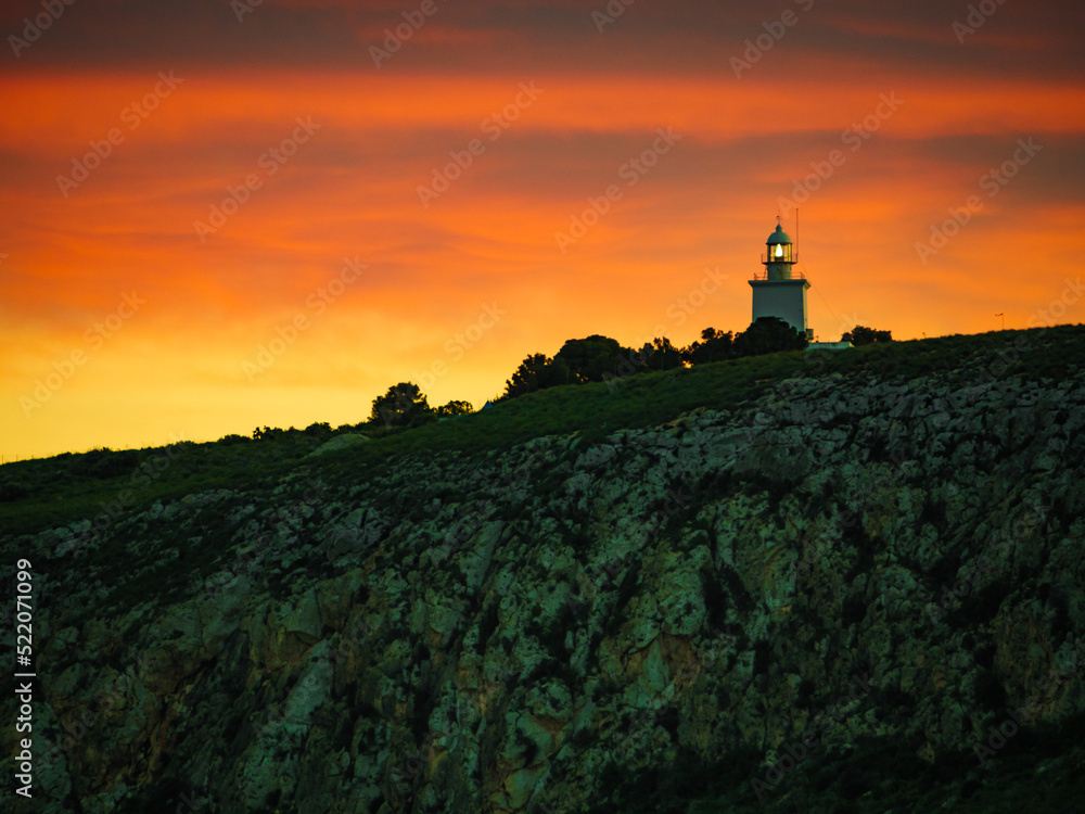 Lighthouse on cliff in Spain