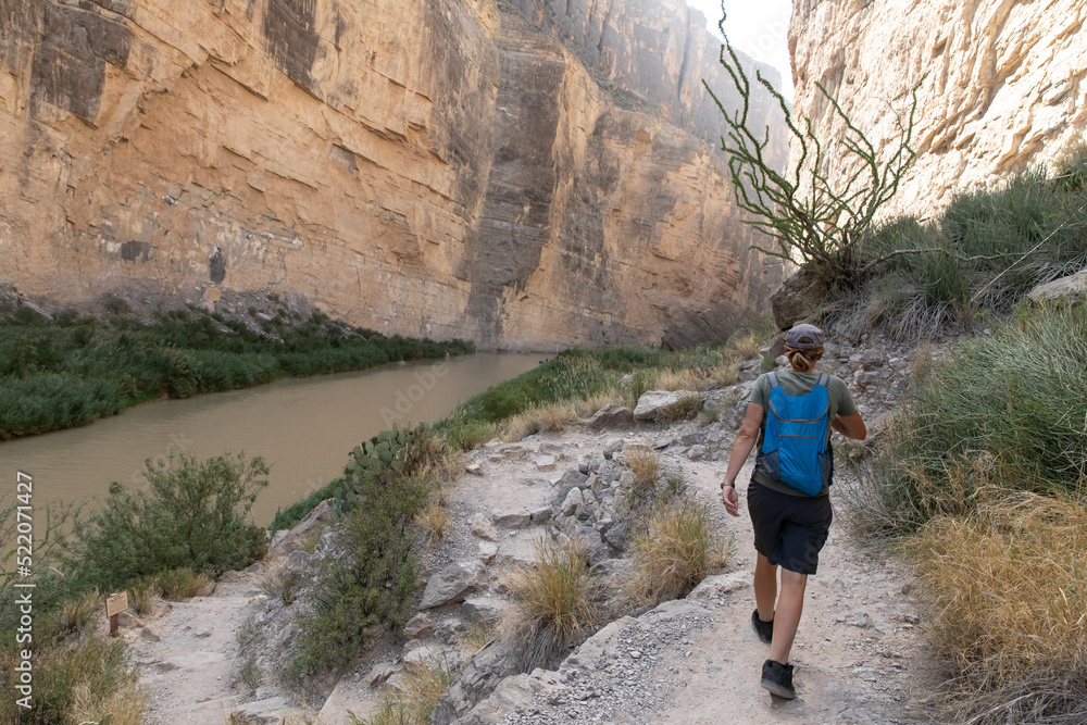 Young woman hiking in Canyon in Big Bend National park texas Young woman hiking in Canyon in Big Bend National park texas