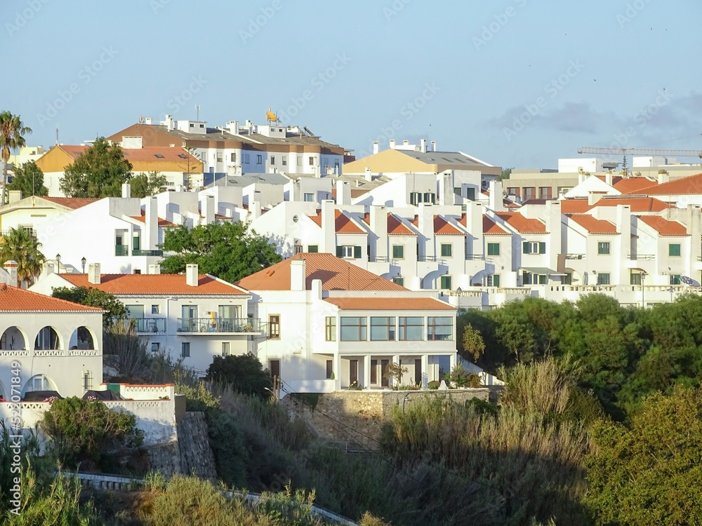 Obraz premium View of white houses with orange roofs in the Portuguese town Sines