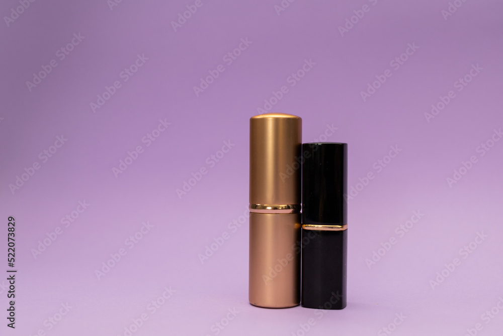 Powder brush in gold bottle and lipstick Powder brush in gold bottle and lipstick