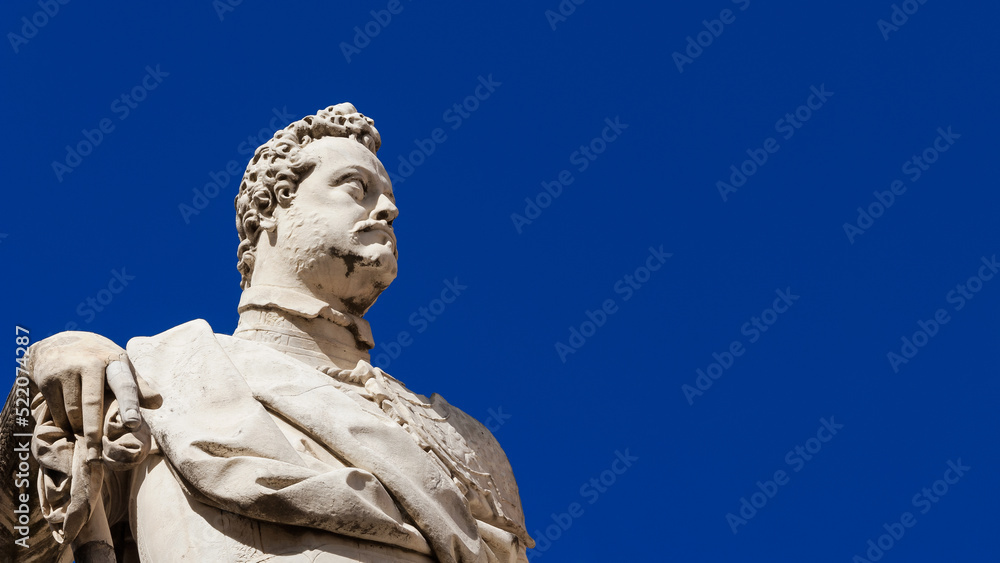 Ferdinando I Medici, Grand Duke of Tuscany. A marble statue erected in 1594 in the historical center of Pisa (with blue sky and copy space)