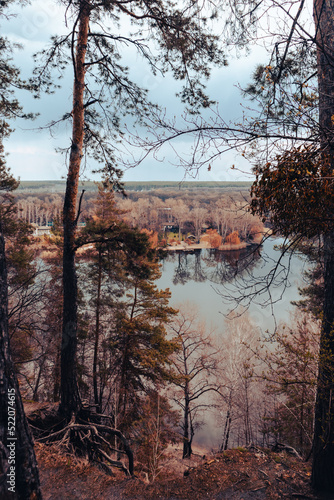 Colored scenery on river with pine trees forest. Cossack mountain, Korobovy Hutora (Gomilshanski forest, Koropove village) on Siverskyi Donets River in Ukraine photo