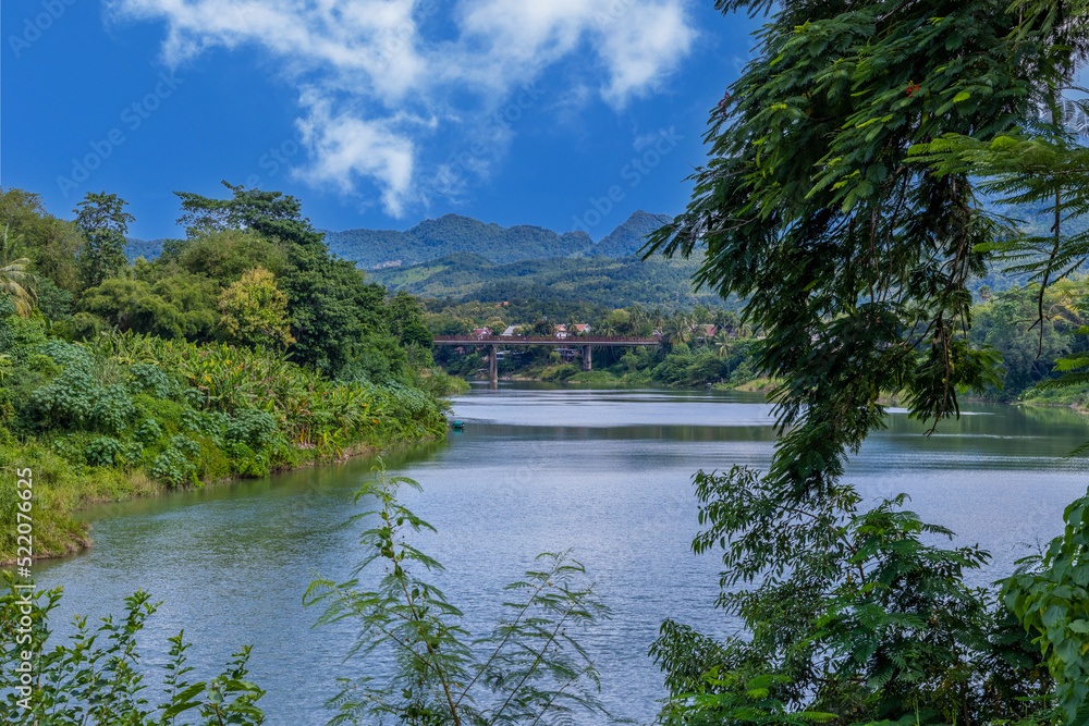 Fototapeta premium Luang Prabang Laos surrounded by the high mountains and the Mekong River. This lovely city is nestled in the high mountains and tropical rainforest