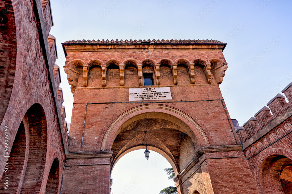 Building facades and medieval architecture along the streets in Bologna