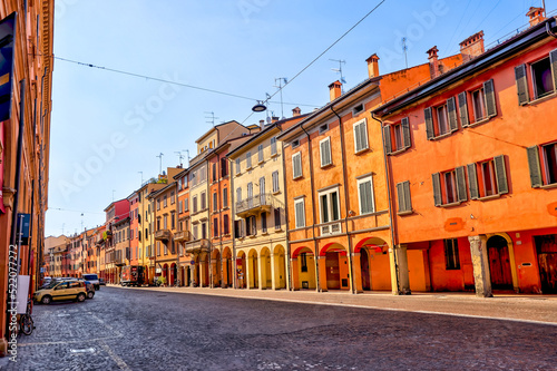 Building facades and medieval architecture along the streets in Bologna