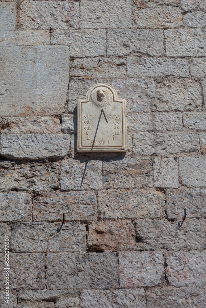 Sundial on the wall of an ancient city
Sundial on the wall of an ancient city