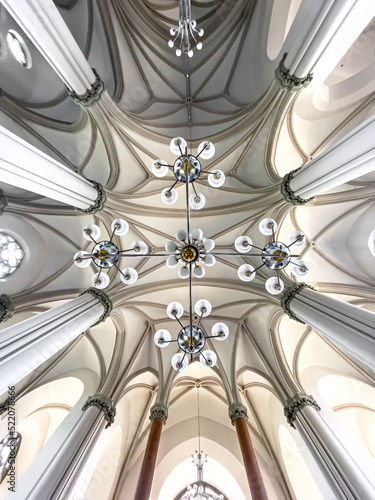 Canvas Print Interior details inside the church, lamps and stained-glass windows