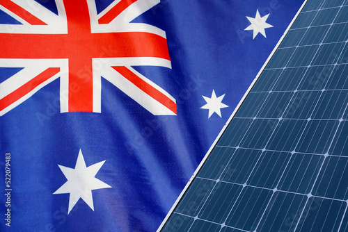 Solar panels against flag Australia background. Solar battery generates a pure electricity. Concept of sustainable resources and renewable energy in Australia photo
