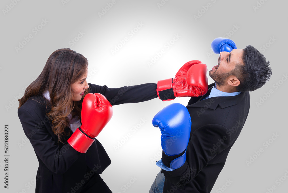 Business people boxing concept,woman hit man on white background,this has clipping path Business people boxing concept,woman hit man on white background,this has clipping path